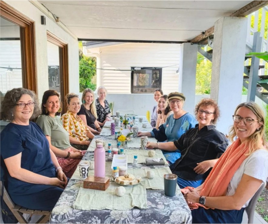 A private pottery event with a group around a long table